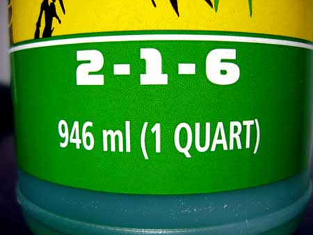 Most nutrient bottles have 3 numbers, called "NPK" which stands for Nitrogen, Phosphorus and Potassium